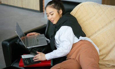 Woman working from her couch at home